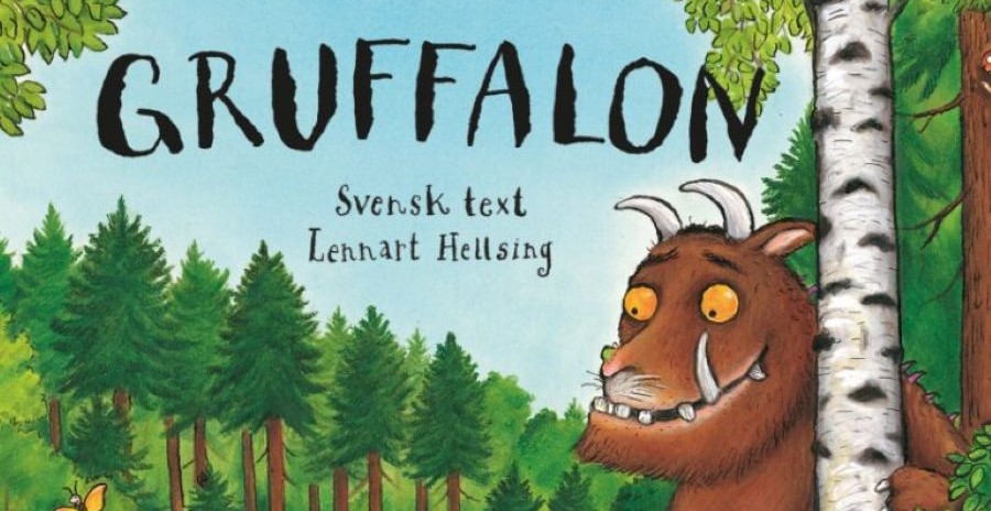 Bokomslag. Skogsmiljö, med en figur och texten "Gruffalon" samt "Svensk text Lennart Helsing".